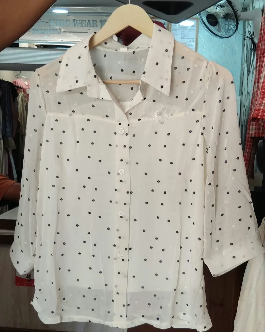 women's white button-down shirt with black polka dots